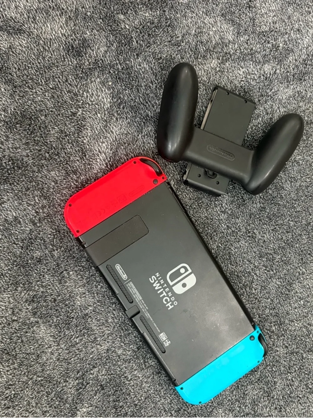 Nintendo Switch with Red & Blue Joy-Con Controllers + hand held controller